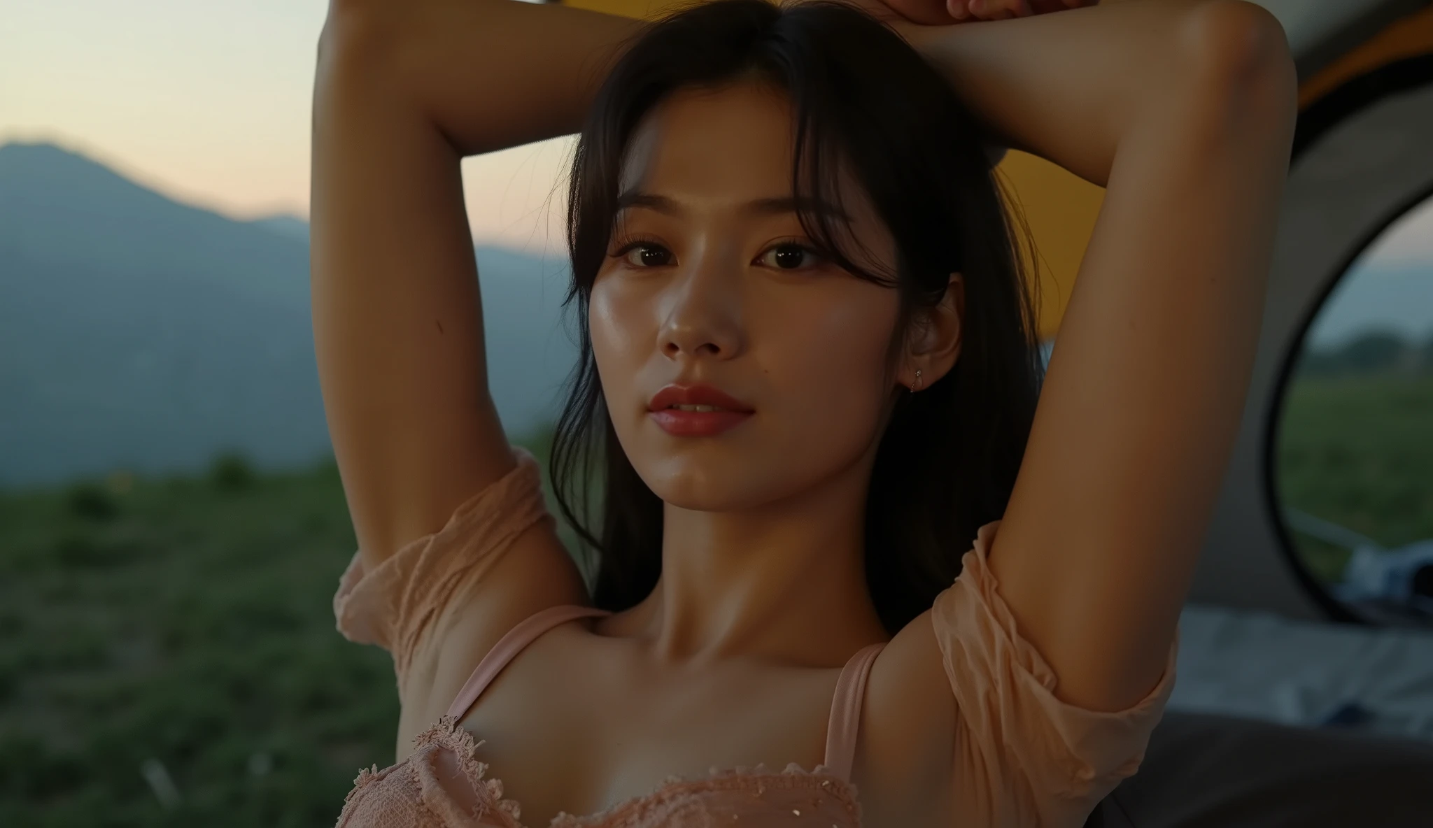 Imagine a close up view of a Beautiful Korean woman with long black hair, Big Breasts, Wearing a sexy indigo bra, arms up, highly detailed armpit, cleavage, Aunt See-Through is sleeping on a tent. dim light from tent lamp, Slightly open tent, sunset view, sunset lighting, a green hill view