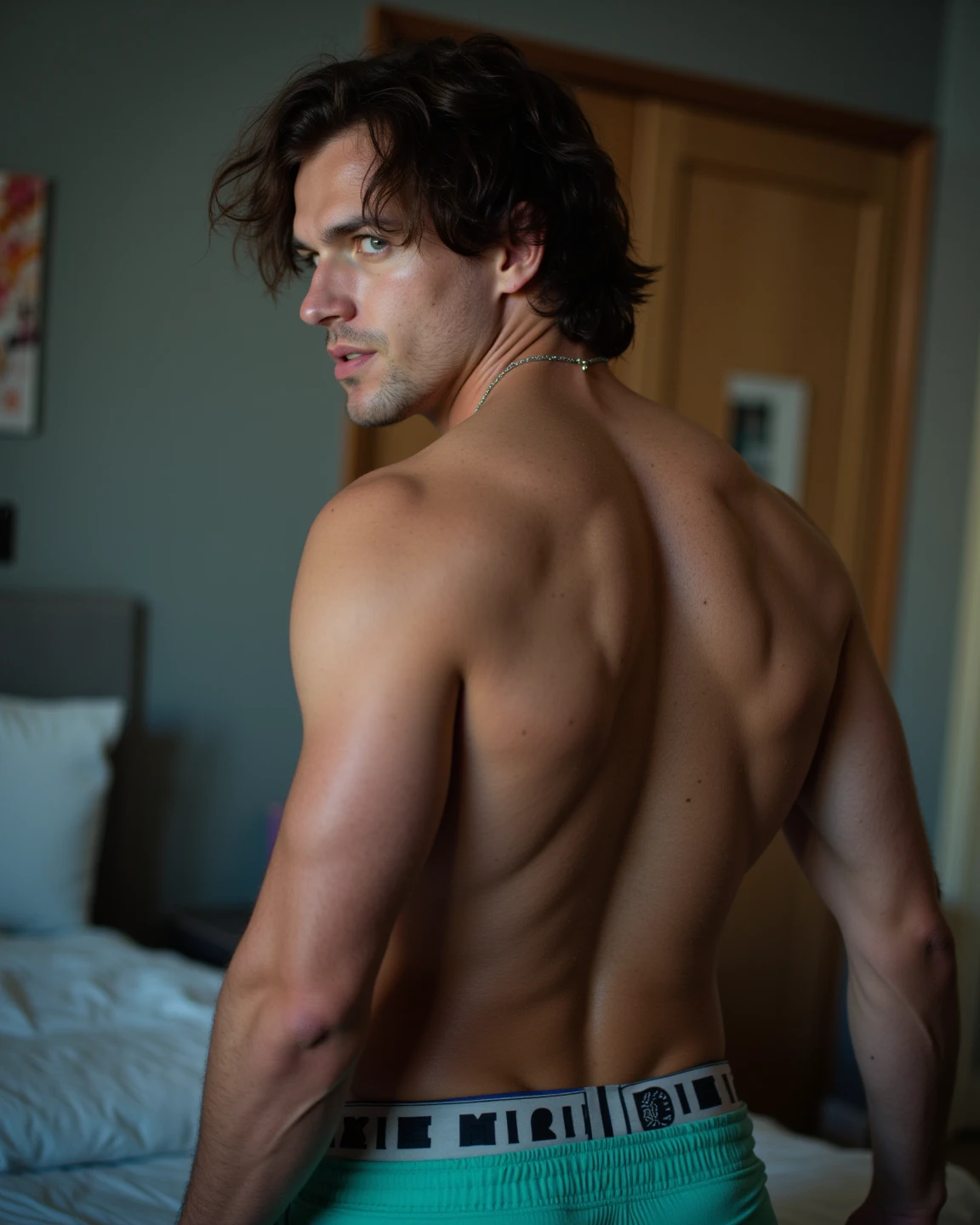 Man tied to a chair shirtless bondage in underwear with pleasure face
