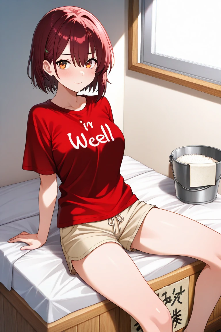 A rice bran enzyme bath is all over the room、wore a red t-shirt with “I'm well” written on it、an adult woman wearing shorts is holding a bucket、wore a red t-shirt with “I'm well” written on it若い女性が鍬を持っていて、wore a red t-shirt with “I'm well” written on it若い男性が鍬を持っている。