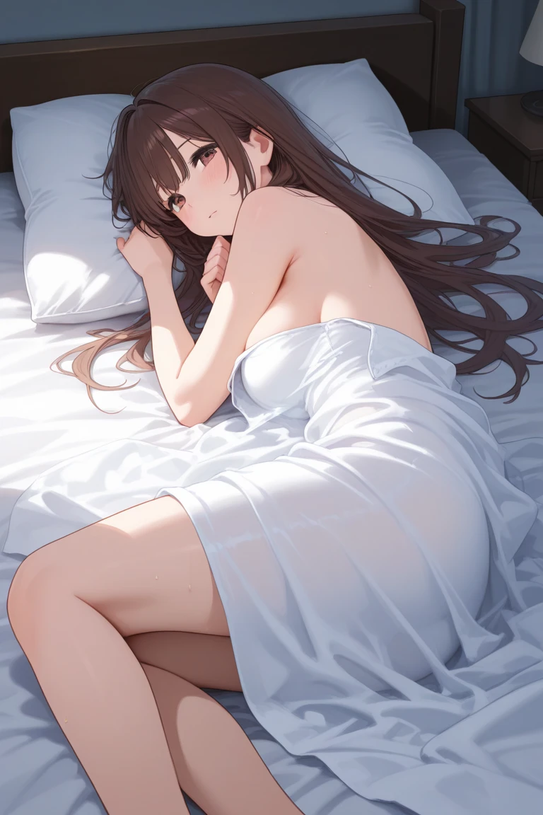 A girl in bed without clothes