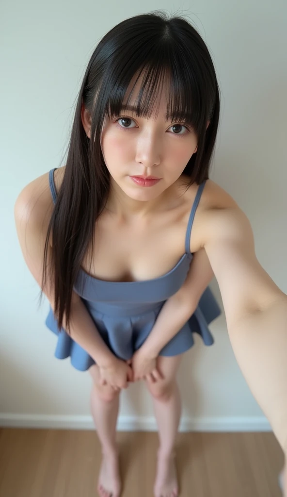 Generate an image of a young woman in a similar pose to the one in the provided image. The woman should be standing in a dimly lit environment with a tiled wall in the background, giving the impression of a poolside or bathroom setting. She should have long black hair, styled naturally, and wear minimal blue lace lingerie, consisting of a small top and bottom. The expression on her face should be gentle and calm. Ensure the lighting highlights her features while maintaining a soft, natural look.