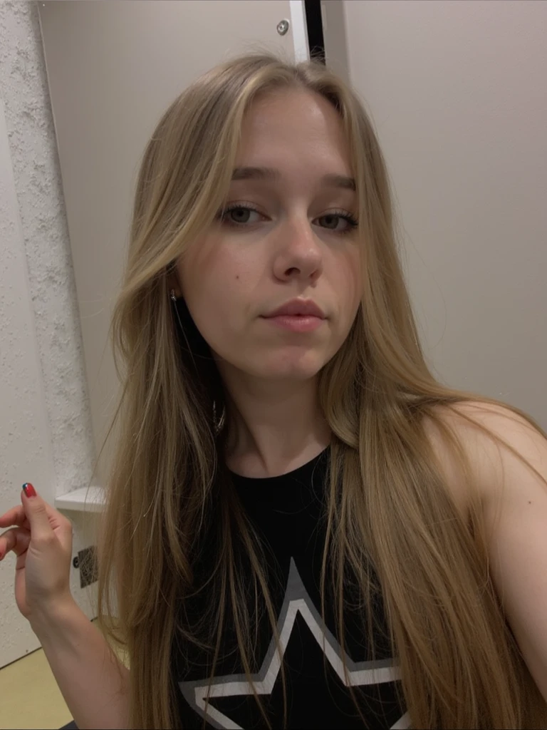 homemade selfie of a beautiful young girl, filmed on a smartphone camera, shoulder-length hair and dyed blonde, holding a bank card in her hand