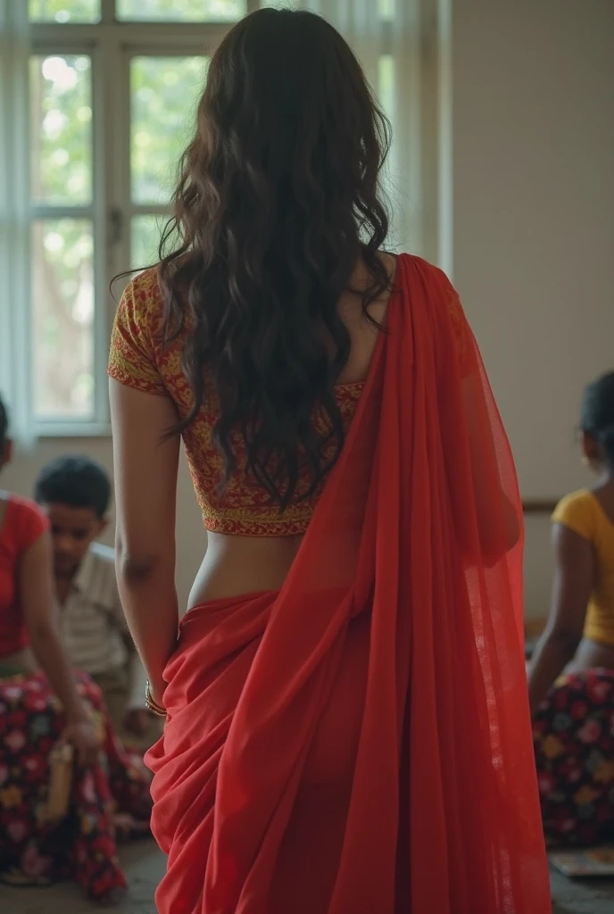 A girl in white shirt dancing in her friends indian wedding