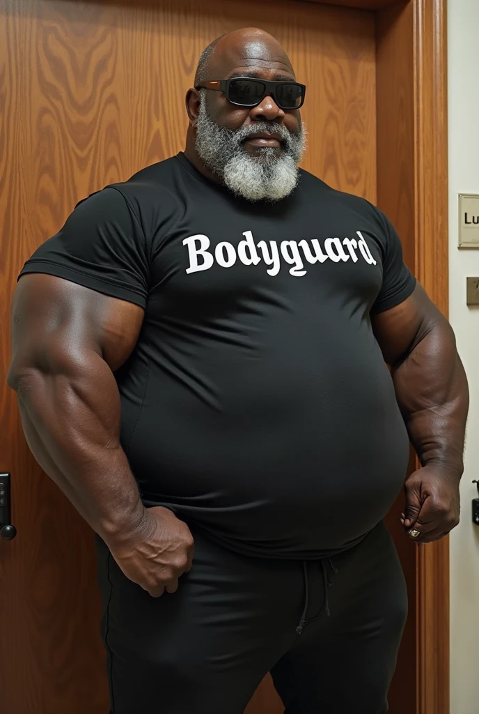  A shirtless full length African American obese bodybuilder with a very oiled body smiling sweaty old man with shaved head with big gray mustaches extremely muscular and extremely fat over 70 years old weighing over 600 pounds very muscular very hairy big pecs with gynecomastia nipples dark women in front of a white wall wearing black leather panties and a leather torso harness 