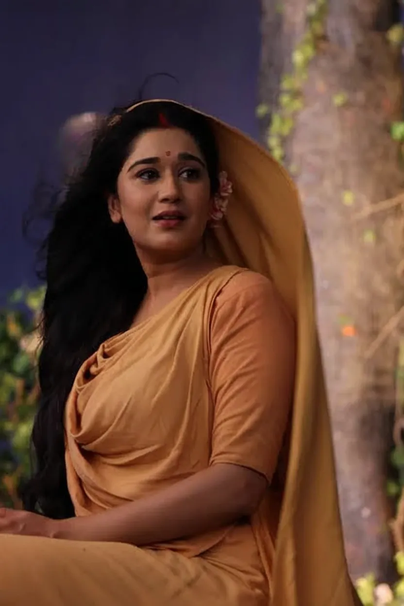 woman in a red sari posing for a picture, a portrait of a plump woman, traditional beauty, indian, candid photo, candid photograph, 45 years old woman, 45 years old woman, sharandula, indian goddess, about 45 years old, wearing a sari, traditional wear, traditional style Saree, traditional saree beauty, sleeveless, strapless, stanapatta, very attractive and beautiful, mid shot portrait, dressed in a sari, plus size