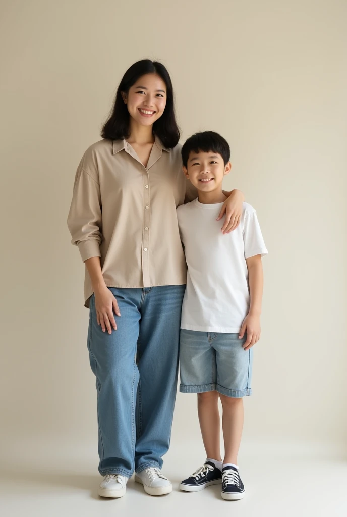 A candid photo of a young child with a short haircut, smiling and wearing a navy blue shirt with a small white logo on the chest. The child is standing next to an adult who is holding chopsticks. The setting appears to be indoors, with a modern design featuring gray flooring, a glass balcony railing, and a tiled wall. The child is looking to the side with a happy expression, creating a warm and joyful atmosphere.