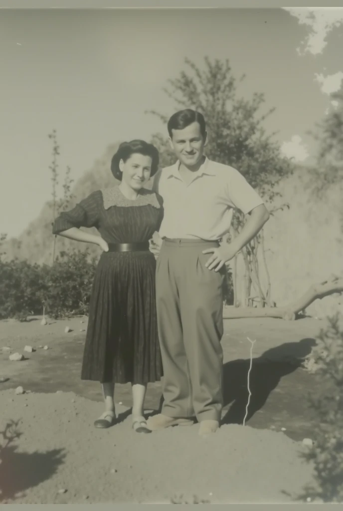 Black and white photograph of a man and woman standing in a field., momma and papa, Location unknown, Ayanamikodon e Irakli Nadar, Parejas portrait, Retrato de dos personas, Pareja portrait, Pareja, Foto 1960, Foto temprana en blanco y negro., Fujita Goro y Jones, una vieja foto en blanco y negro