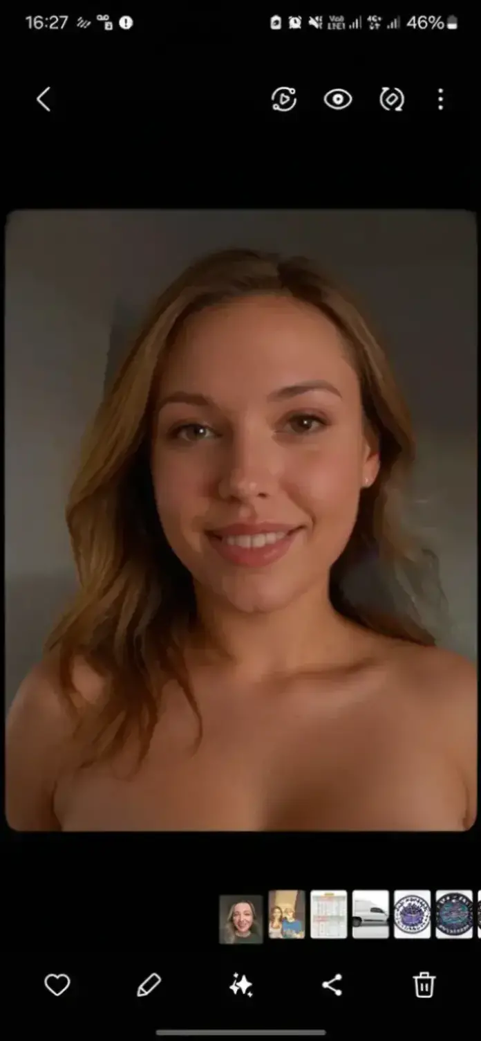 Emmanuelle Béart taking a selfie photo completely naked and smiling