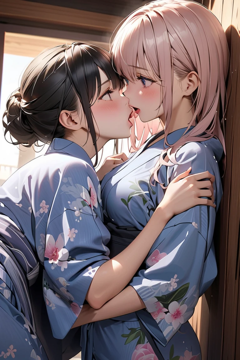 Two girls wearing Japanese clothes sitting in bed with close body contact