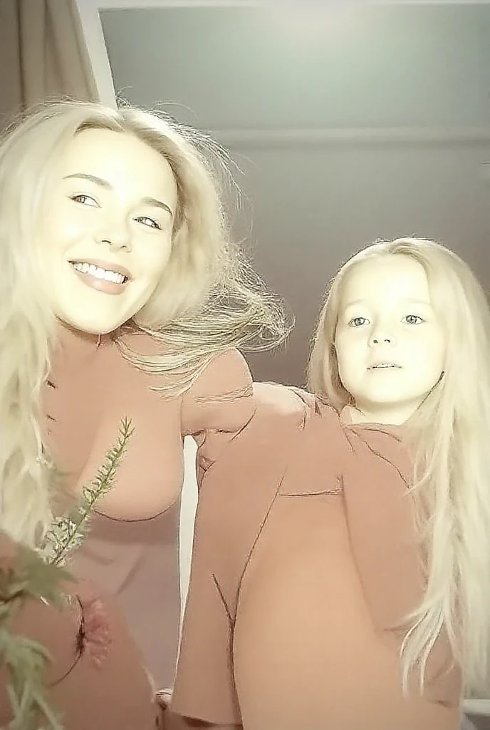Mother and daughter , daughter shows heart with hands