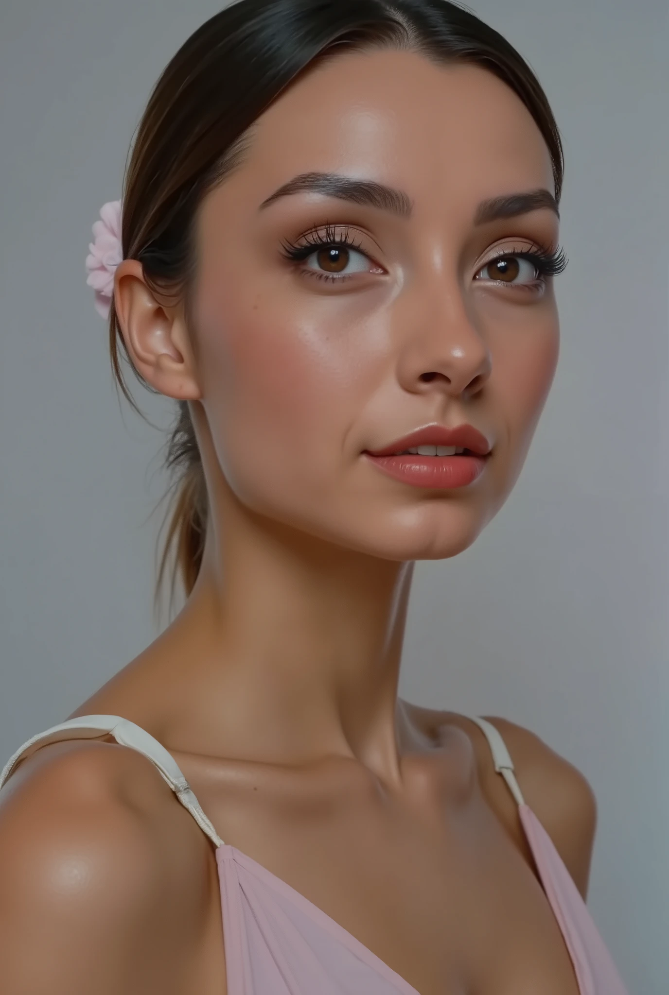 woman posing for a picture, she is sad, ponytail, flat grey background