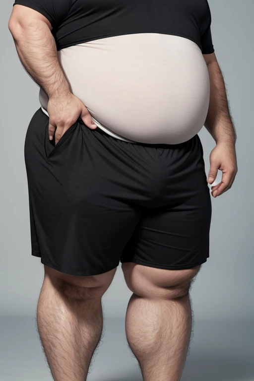 A man wearing jeans and he scaling his fat 