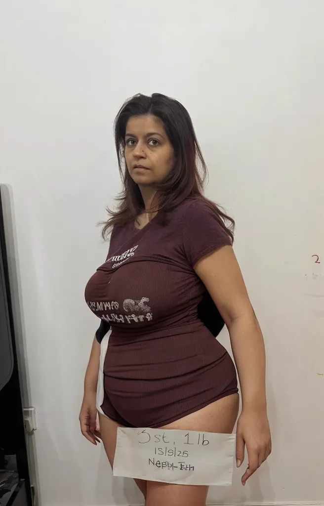 (((Sharpen))), open leg wide, hotel room, full body visible, RAW, 8k, hard light, realistic skin texture, (((photorealism)), closeup, ((fifty five years old, gray-haired)), horney, hot, village woman, indian look, a woman is standing in bedroom, indian village house bedroom, ((her body details are looking like as fifty five year old woman)), she is waiting for young boy,sultry body with sexy belly, very attractive and beautiful, mature, full body visible, (wide hips:1.8), (she has largest hips ever:1.2),curvy,she has a jiggly fat round belly,thick thigs, beautiful female, (skinny waist and thick hips:1.2), (thick hips:1.5), (largest haunches ever:1.8), large thighs, solo indian woman,curvy accentuated booty,full body,detailed (wrinkles, blemishes!, folds!, moles, viens, pores!!, skin imperfections:1.1), (she is looking like village milf, mature, mother in law, aunt:1.5),her face look like Tisca Chopra, (flat breasts, small breasts, small, (small bust:1.2), small bust:1.2), flat and saggy breasts, (she has big booty),(looking directly at viewer,rear view), (she is wearing red t-shirt and skinny blue jeans:1.1)