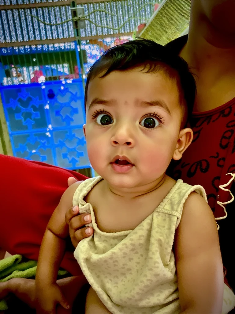 there is a baby that is laying down on a pillow, ayan nag, with cute doting eyes, innocent face, with accurate face, beautiful cute, innocent look, very very very beautifull face, cute beautiful, young child, vinayak, beuatiful face, young cute face, marvelous expression, taken with sony alpha 9, nivanh chanthara