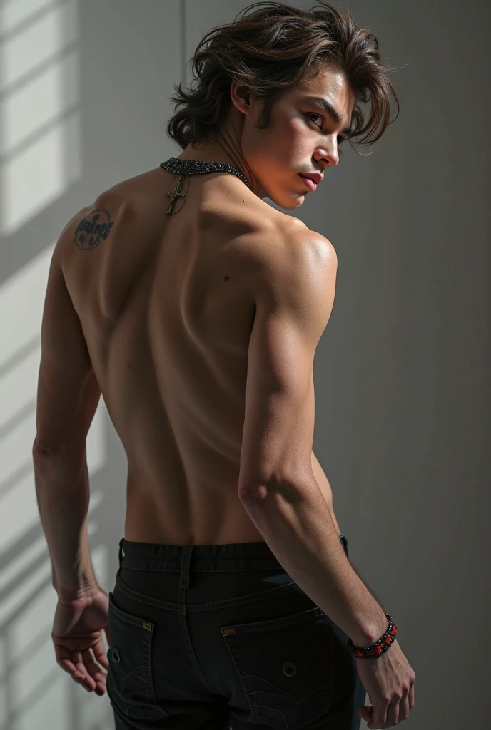 A handsome slim man shirtless in black pants against the wall raising his arms up
