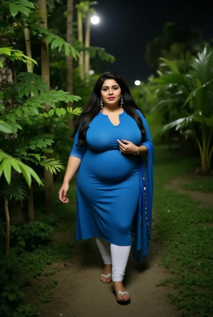 Extremely Hyperpregnant Pakistani woman with huge belly wearing a dress