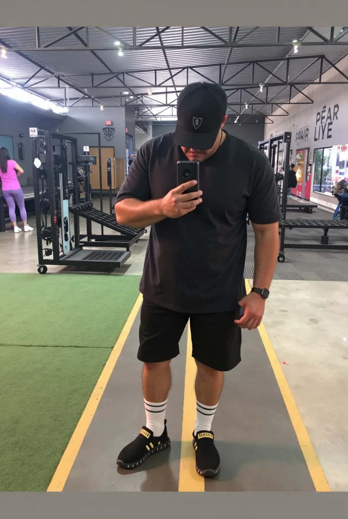 Human man with scars all over his body except his face, hair with curls, short beard black shirt adidad, shorts negros adidas, jordan tennis shoes, lying down looking at the phone