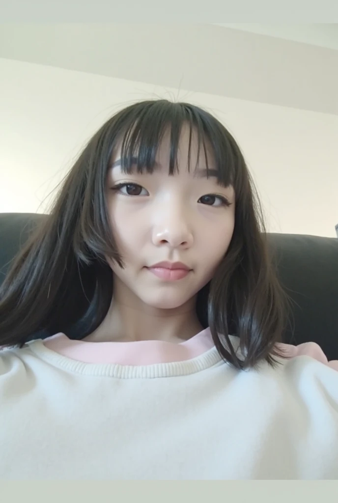 there is a woman sitting on a couch with a cell phone, 2 7 years old, 30 year-old woman, 3 0 years old woman, 2 9 years old, 2 8 years old, mai anh tran, dang my linh, With long hair, 3 2 - year - old, 38 years old, nivanh chanthara, with short hair