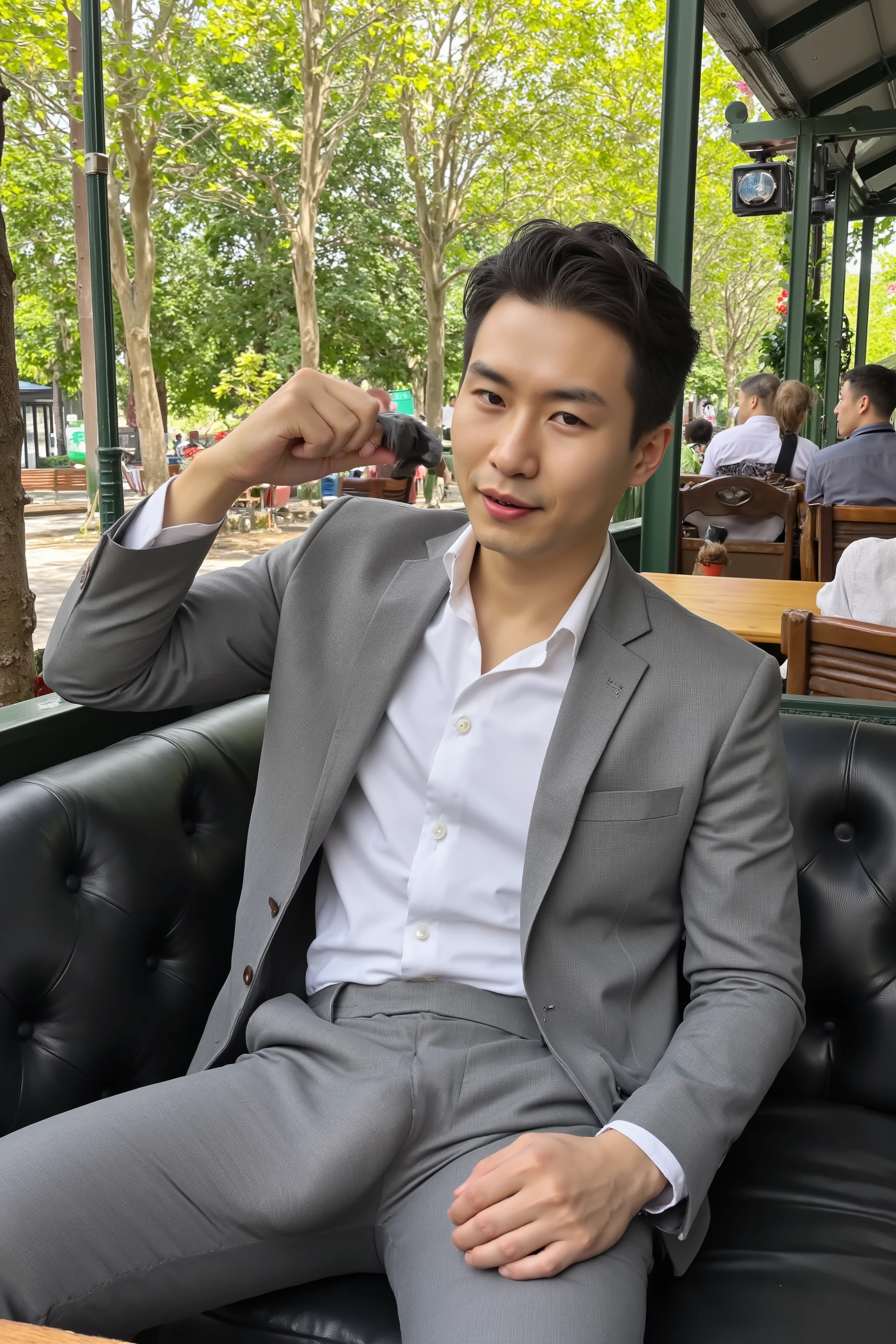 A highly photorealistic image of a stunningly handsome Asian man sitting confidently on a luxurious leather couch in a park. He is wearing a perfectly tailored grey formal suit and a crisp white dress shirt, neat and fully buttoned. His pants are unzipped, and he is actively stroking his fully erect penis with one hand, cum shooting out from the tip, glistening and dripping along the shaft and his hand. His expression is intensely seductive and provocative, looking directly into the camera with a slight smirk and lustful eyes. His thighs are slightly parted, emphasizing his dominance and confidence. A few well-dressed men in the background are slightly out of focus, sitting or walking through the café casually. Strong emphasis on realistic body anatomy, skin texture, genital details, suit fabric tension, and photorealistic lighting. 8K ultra-detailed with strong natural sunlight and indoor café ambience. Focus on , erotic energy, and elegant setting. 
