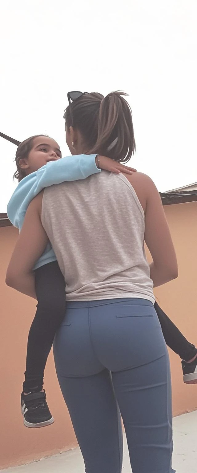 10 year old hugging another in the park in shorts, realisitic, real, detailded, luz realisitic, good lighting, 4K