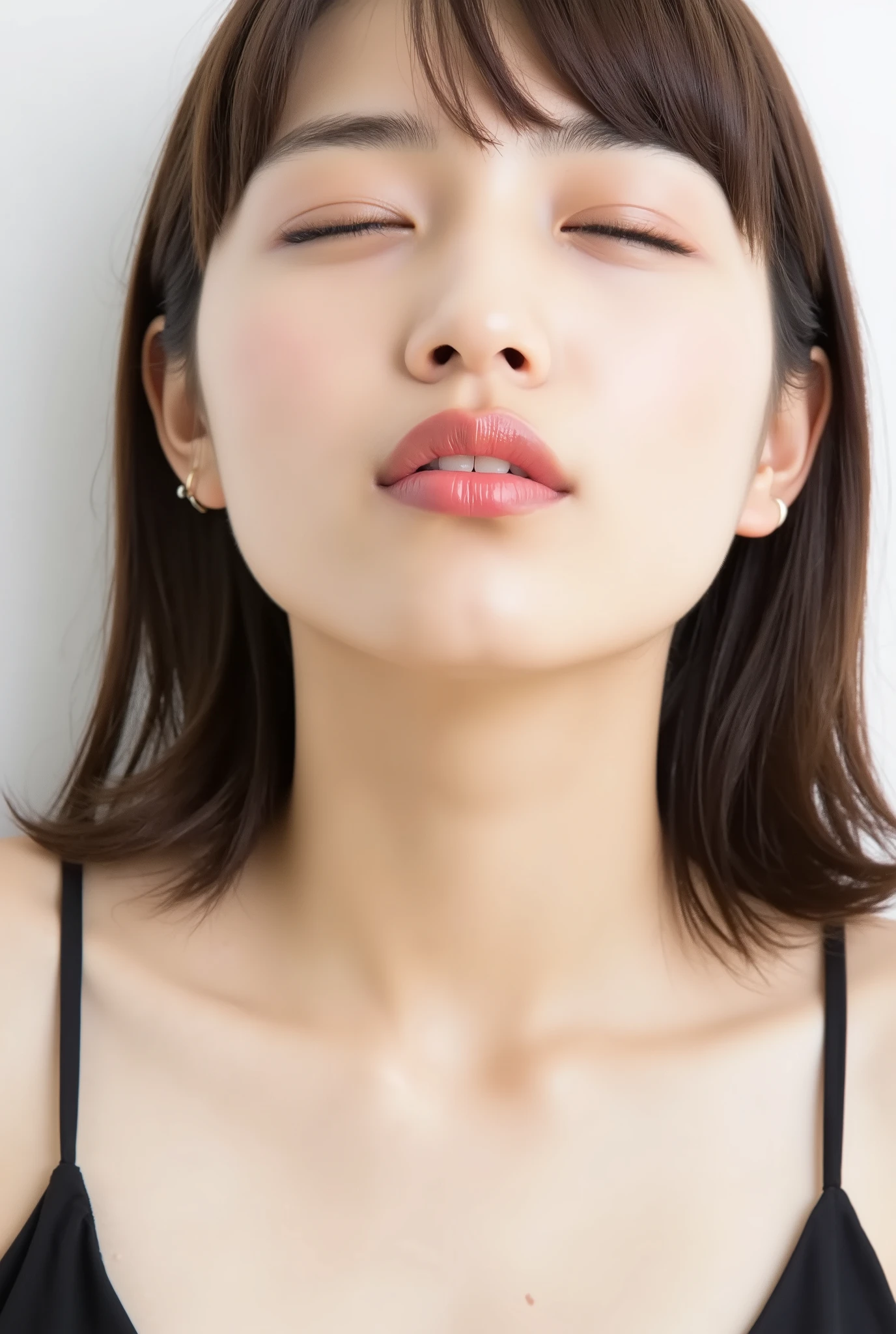 Japanese girl, flushed cheeks, extremely deredere expression, eyes closed, big soft smile while puckering lips, lips sharply pursed and pushed forward, glossy pink lips, kiss face, black camisole, upper body from collarbone up, looking slightly up. Shot from 35° above, frontal angle, white studio background, no hands visible.
