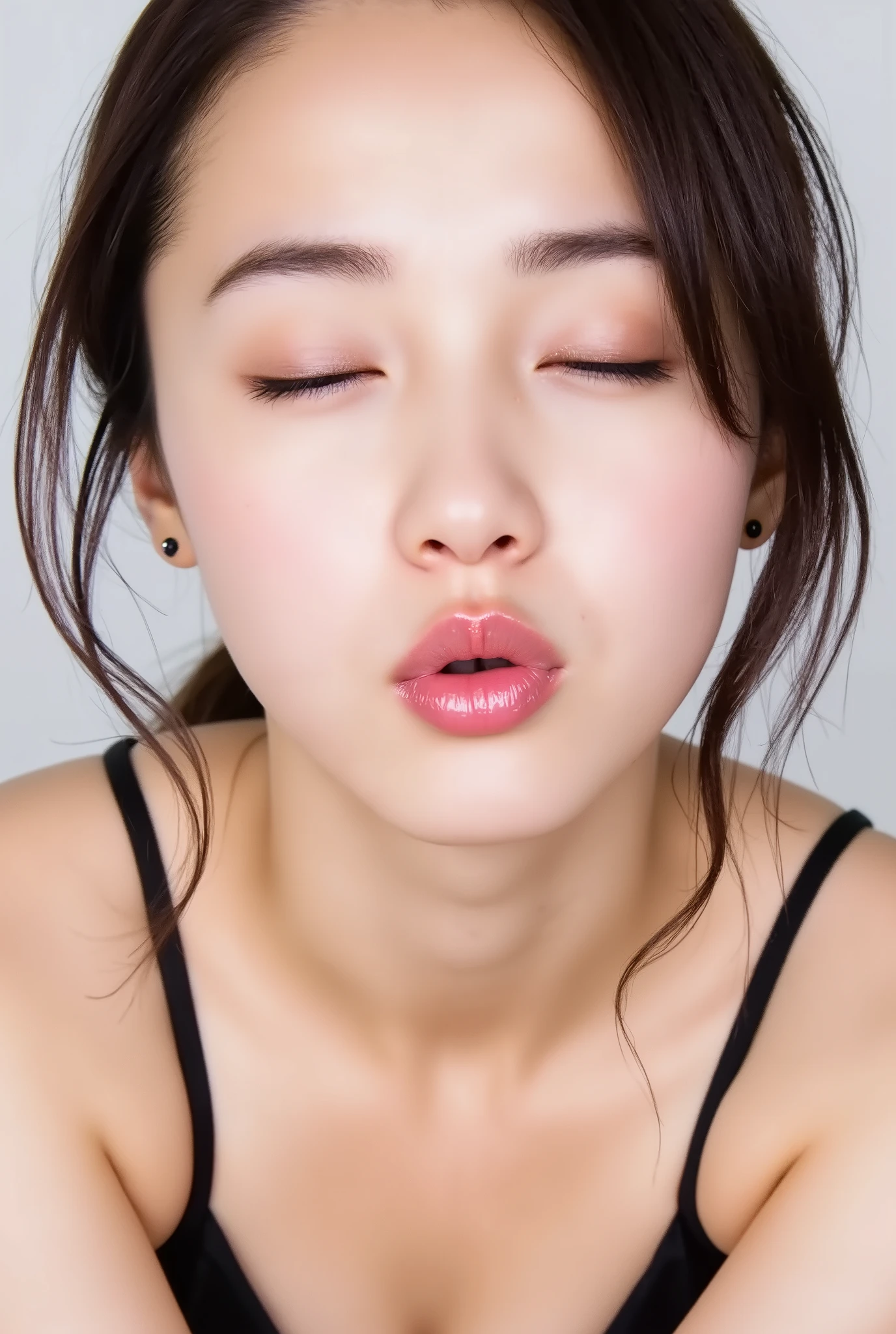 Japanese girl, head and collarbone in frame, black camisole, lips strongly pushed forward in a rounded puckered shape, circular kissy lips with intense gloss, lips as main focal point, soft pink wet lips with high-shine highlights, eyes closed with joyful smile, flushed cheeks and ears, dreamy and melting happy expression, slightly tilted head, natural unfiltered skin texture with faint peach fuzz, camera angle slightly above (35°), soft white studio background