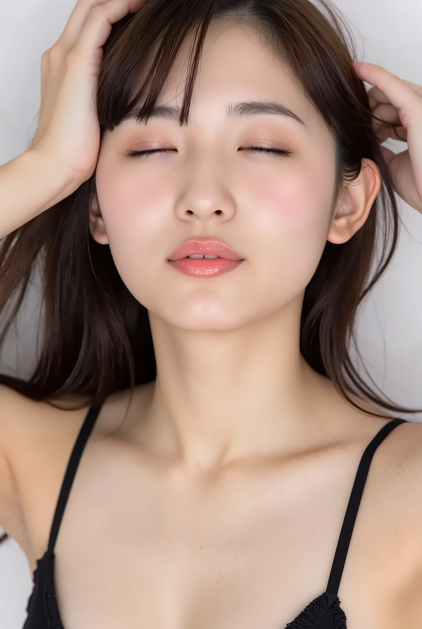 Japanese girl, head and collarbone in frame, black camisole, lips strongly pushed forward in a rounded puckered shape, circular kissy lips with intense gloss, lips as main focal point, soft pink wet lips with high-shine highlights, eyes closed with joyful smile, flushed cheeks and ears, dreamy and melting happy expression, slightly tilted head, natural unfiltered skin texture with faint peach fuzz, camera angle slightly above (35°), soft white studio background