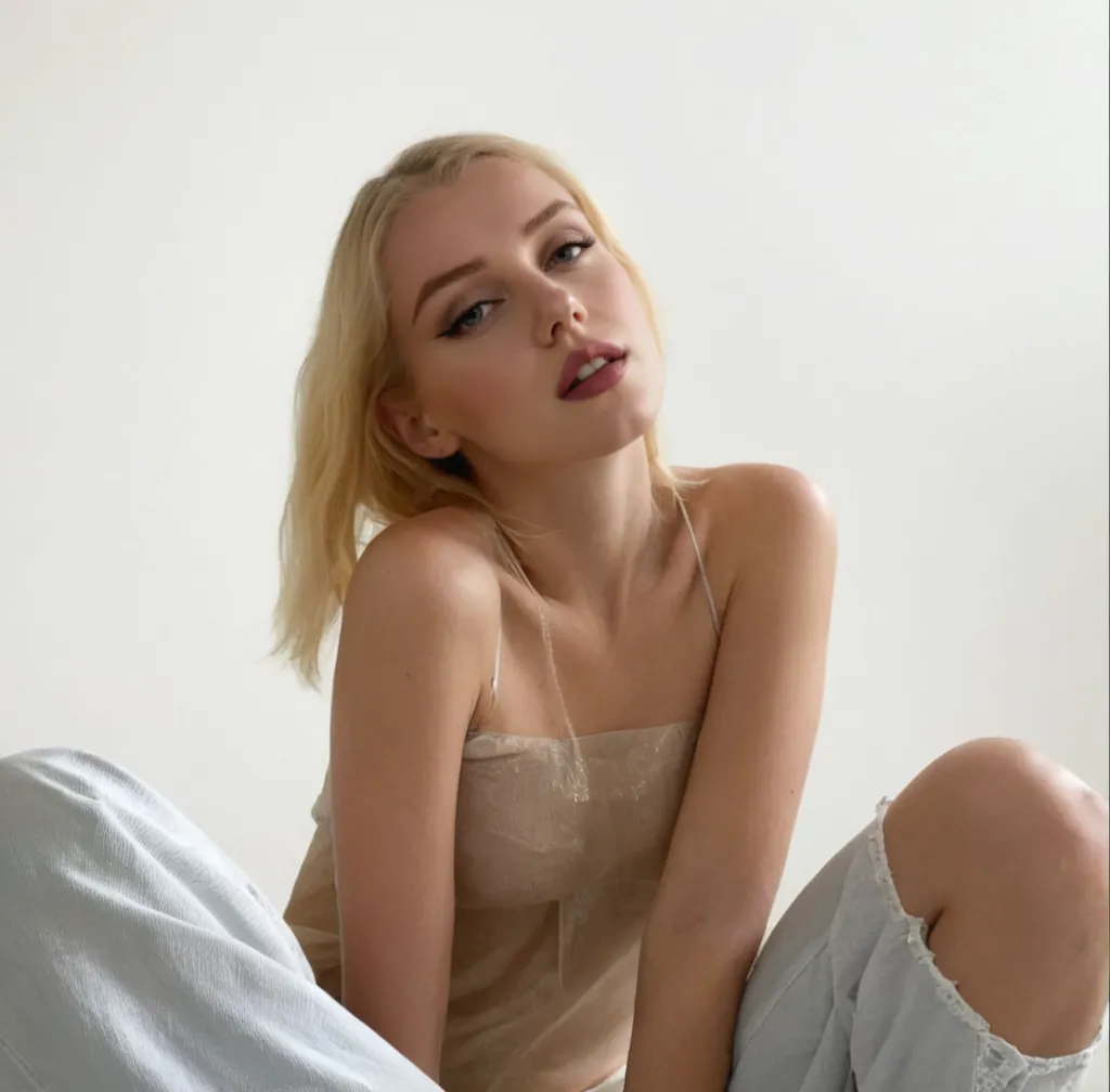 "A woman with blonde hair and a white turtleneck sweater, Ava Max, blonde hair and large eyes, long blonde hair and large eyes, Yelena Belova, Angelina Stroganova, a gorgeous blonde, stunning beauty, large, thick, and bold eyebrows, Kailee Mandel, blonde, perfect face, Aleksandra Waliszewska, perfect white-haired girl."