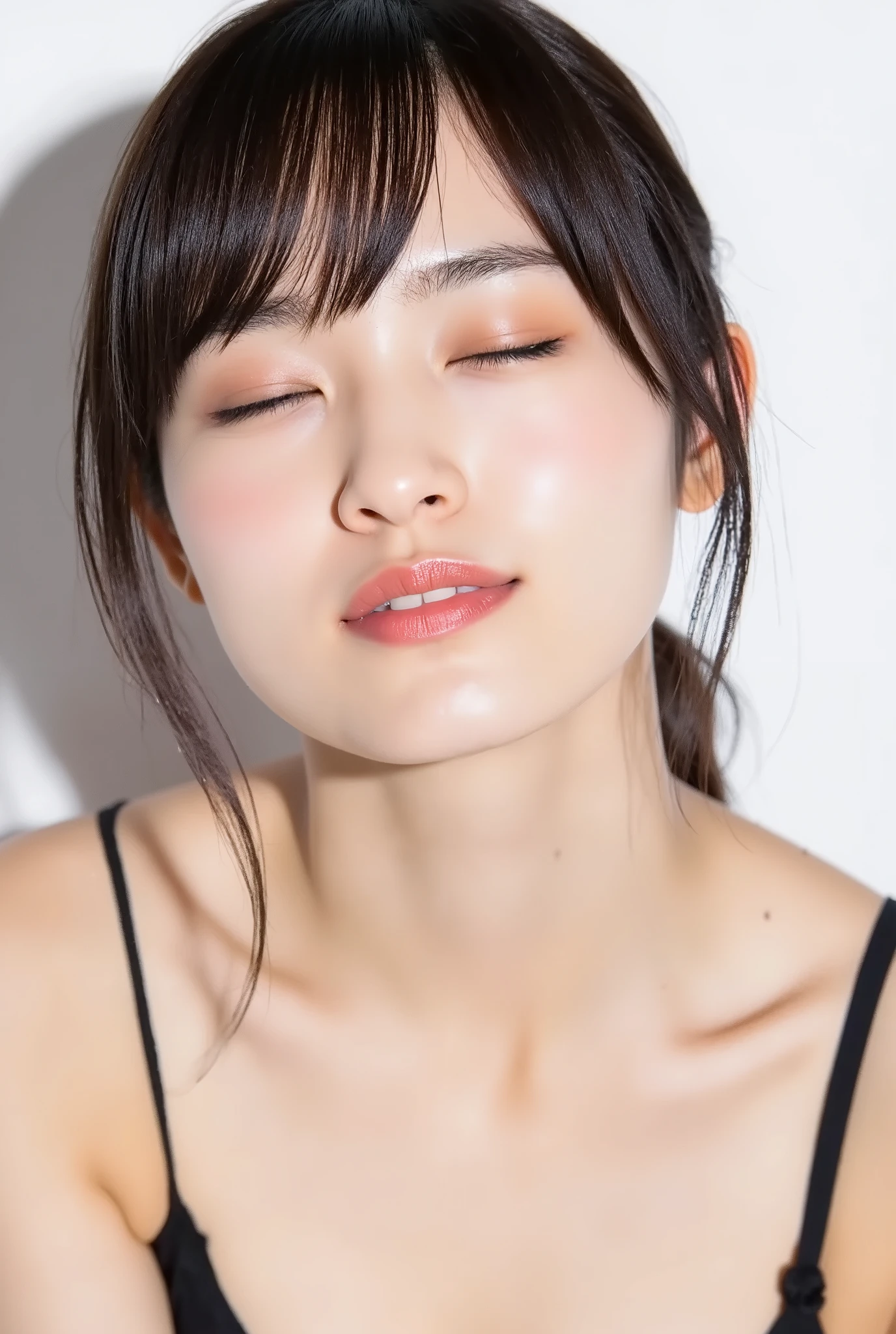 beautiful young woman, eyes closed, cheerful smiling expression, outer corners of eyes lowered, blushing cheeks, black camisole, collarbone visible, natural matte skin with fine texture, tightly puckered lips, lips pushed forward, small round kissy mouth, ultra-glossy soft pink lips, light reflecting off lips, dreamy expression, euphoric mood, white studio background, soft frontal light, full head in frame, camera angle from slightly above