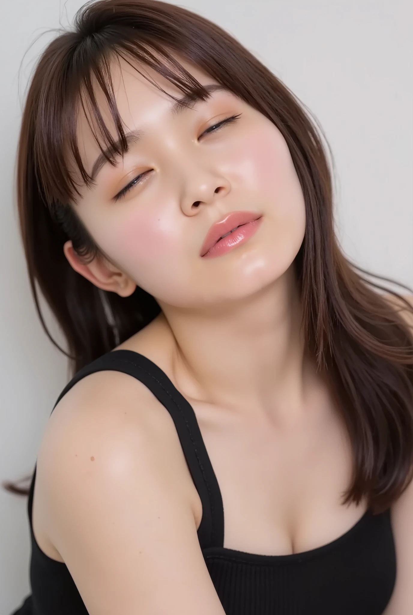 ultra-detailed close-up of a beautiful girl, collarbone-up composition, white studio background, soft natural lighting, slightly elevated camera angle (around 35 degrees), full face and head visible in frame, chin slightly raised, eyes gently closed, deeply affectionate smile, cheeks and ears flushed, dreamy, blissful, euphoric expression, mouth puckered and protruding with a rounded kiss shape, glossy moist lips with shimmering highlights, soft lips reflecting light, extreme focus on lips, inviting kiss pose, longing expression, desperate affection, dere-dere mood, hands behind her back and not visible, natural skin texture with visible peach fuzz, matte facial skin, black camisole strap visible, soft head tilt, bokeh background and soft facial contour blur to emphasize lips, overflowing with affection and dazed joy