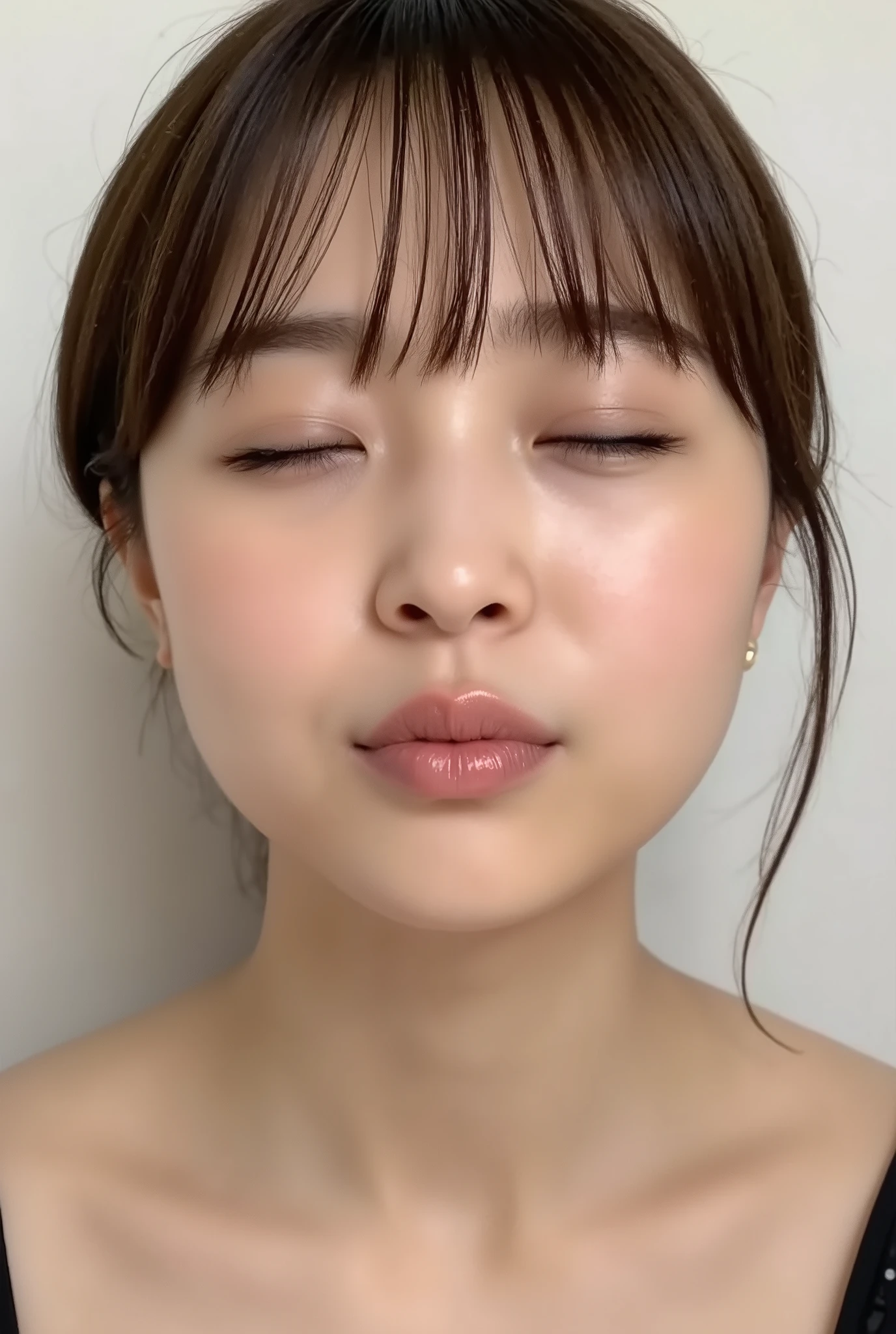 ultra-detailed close-up of a beautiful girl, collarbone-up composition, white studio background, soft natural lighting, slightly elevated camera angle (around 35 degrees), full face and head visible in frame, chin slightly raised, eyes gently closed, deeply affectionate smile, cheeks and ears flushed, dreamy, blissful, euphoric expression, mouth puckered and protruding with a rounded kiss shape, glossy moist lips with shimmering highlights, soft lips reflecting light, extreme focus on lips, inviting kiss pose, longing expression, desperate affection, dere-dere mood, hands behind her back and not visible, natural skin texture with visible peach fuzz, matte facial skin, black camisole strap visible, soft head tilt, bokeh background and soft facial contour blur to emphasize lips, overflowing with affection and dazed joy