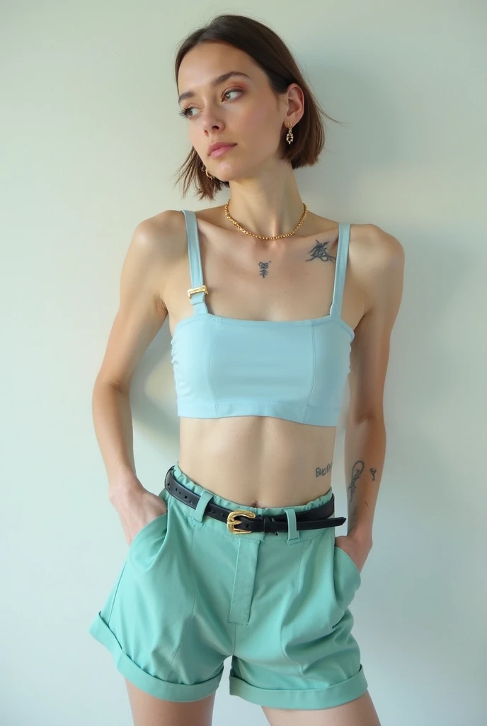 Daisy Ridley dressed in blue sheer top with pants wearing a headband