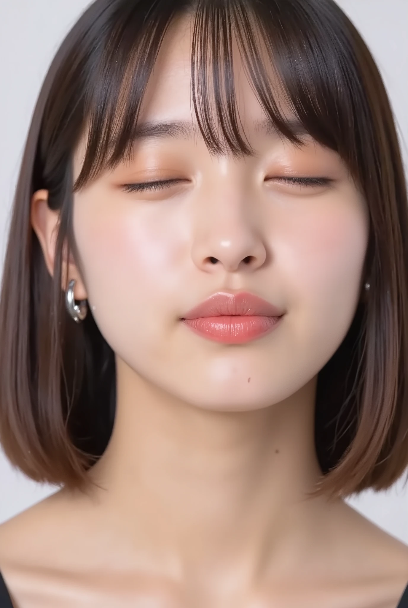 ultra-detailed close-up of a beautiful girl, collarbone-up composition, white studio background, soft natural lighting, slightly elevated camera angle (around 35 degrees), full face and head visible in frame, chin slightly raised, eyes gently closed, deeply affectionate smile, cheeks and ears flushed, dreamy, blissful, euphoric expression, mouth **tightly puckered**, **strongly protruding lips**, lips forming a **distinct sharp rounded kiss shape**, **exaggerated pout**, **hyper-emphasized kissy lips**, glossy moist lips with shimmering highlights, soft lips reflecting light, extreme focus on lips, inviting kiss pose, longing expression, desperate affection, dere-dere mood, hands behind her back and not visible, natural skin texture with visible peach fuzz, matte facial skin, black camisole strap visible, soft head tilt, bokeh background and soft facial contour blur to emphasize lips, overflowing with affection and dazed joy