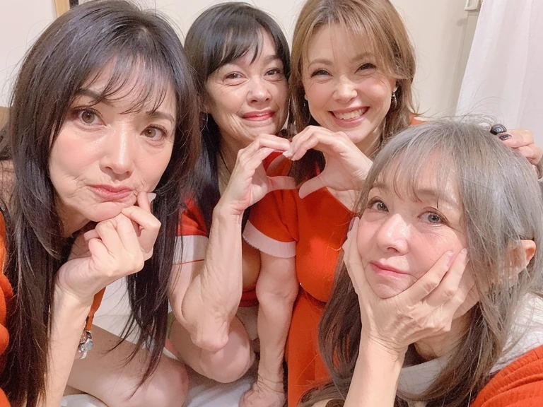 2 japanese idols are in a glass box on akbingo. They are wearing swimsuits. They have to answer questions otherwise a lot of gunge will cover them. They are embarassed as the gunge sprays them, then they are covered by even more gunge