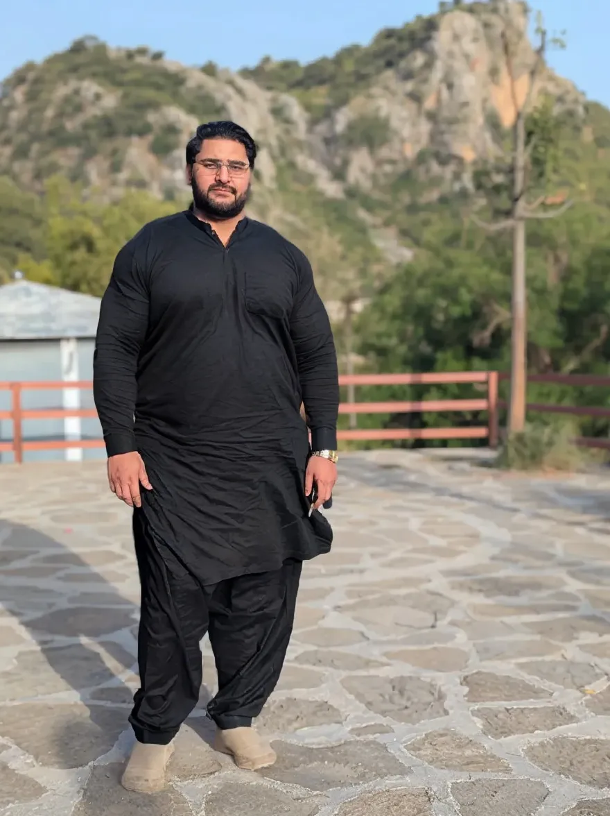Big man shape Infront of hilarious green desert