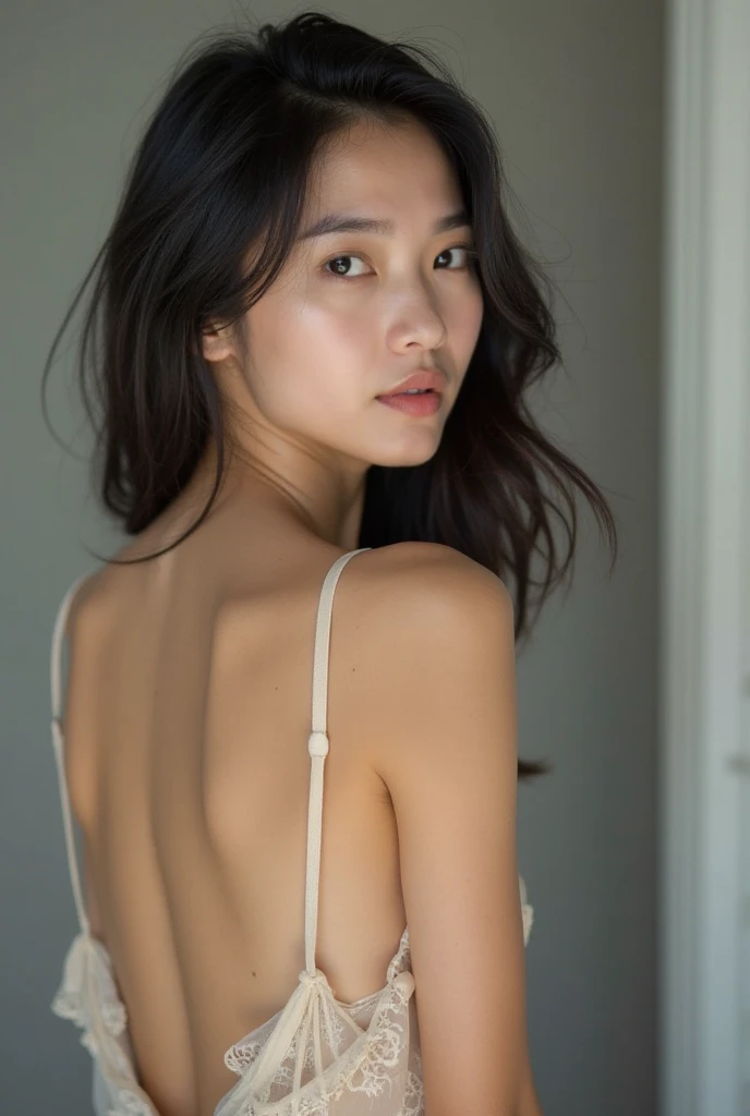 The girl shows her entire hairless body while looking at the camera.
