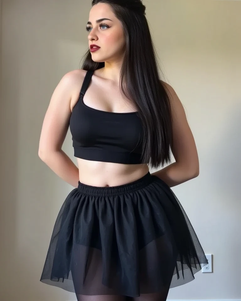 24 years old, she is in the club. Her long, dark brown hair cascades in loose, soft waves down to her waist, adding to her glamorous appearance. The hair is glossy and well-groomed, framing her face beautifully.
Her complexion is smooth and radiant, with a warm, even tone. Her facial features are well-defined and harmonious: she has almond-shaped, expressive brown eyes accentuated by naturally long eyelashes and well-groomed, arched eyebrows. Her eyes are subtly enhanced with neutral eyeshadow and mascara, giving them depth and allure. She has a straight, proportionate nose, high cheekbones, and full, naturally pink lips that curve into a slight, confident smile.
She is dressed in a form-fitting, black dress that perfectly balances sophistication and sensuality. The dress features a deep V-neckline adorned with intricate lace trim, which adds a seductive touch while maintaining elegance. The bodice of the dress is partially transparent with delicate black lace panels, offering a tantalizing glimpse of her skin beneath. This lace detailing extends from the neckline down to her waist, cinching in to highlight her slender midsection.
The skirt of the dress hugs her hips and thighs, accentuating her hourglass figure. It’s crafted from a smooth, stretchy fabric that clings to her curves and tapers off just above her knees, enhancing the dress’s sexy silhouette. Her posture is relaxed yet assured, with her arms resting naturally by her sides, further emphasizing her poised and graceful demeanor, Create a photo featuring a woman with light, fair skin that has a warm undertone, with a smooth and even complexion and a subtle, natural glow. The lighting should be soft and diffused, casting a gentle, flattering light on her face and body, eliminating harsh shadows, and the overall ambiance should convey a warm and inviting atmosphere, one person