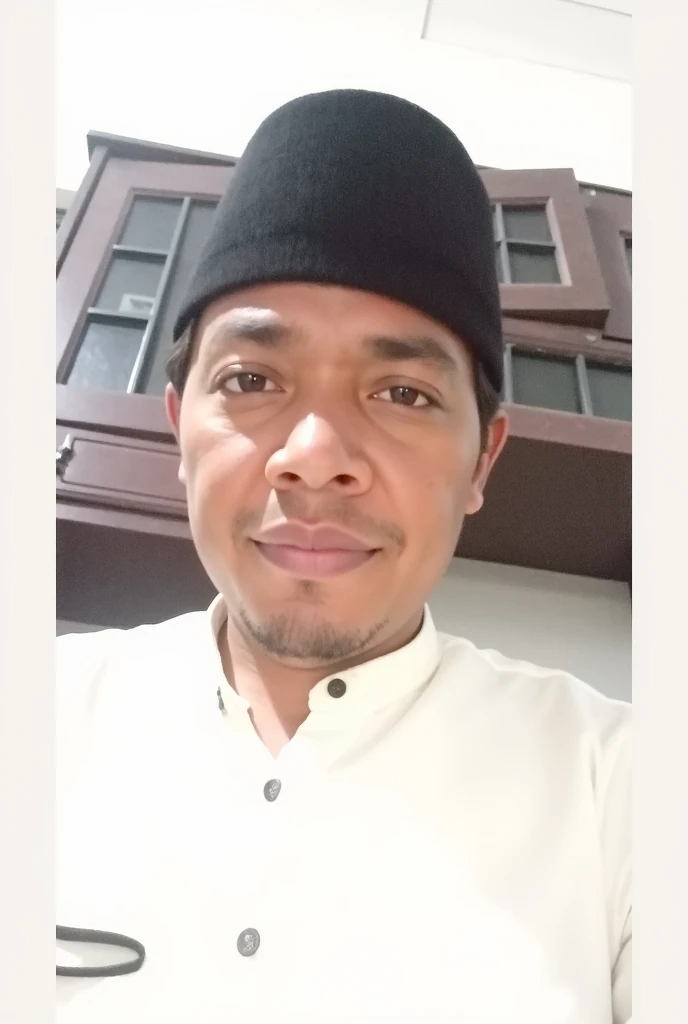 an Indonesian Muslim man, wearing glasses, beard, thin mustache