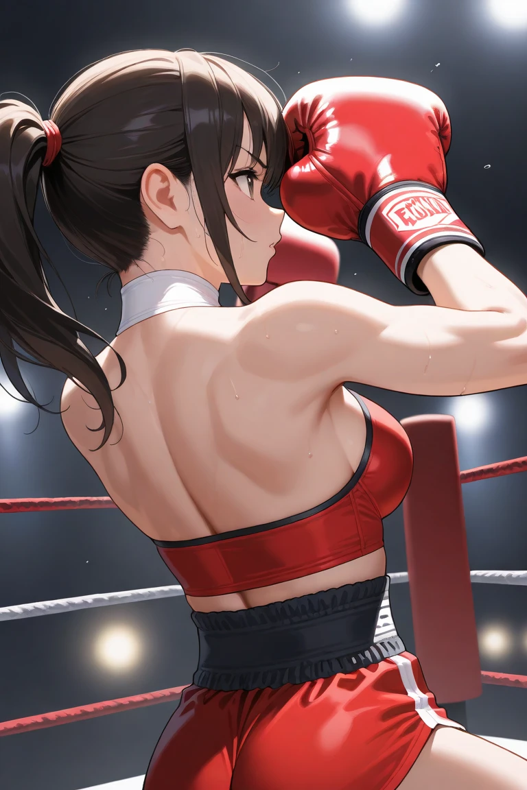 Two women in Chinese dresses are boxing and fighting in the ring
