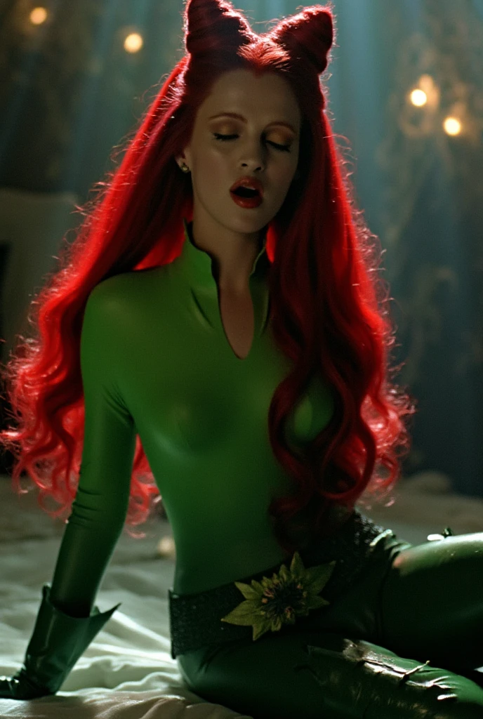 A woman with red velvet hair, green at the tips. She has green emerald eyes with hazel. In her hands are two green flames.