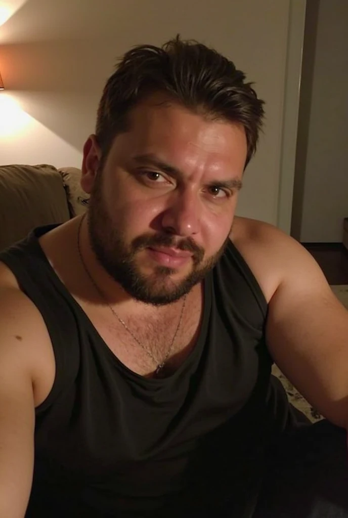 a tattoed handsome turkish man with brown eyes and fade-cut hair, movie-still shot, bearded, handsome, lounging relaxed at home sofa sitting, huge soft flaccid cock dangling between his legs,