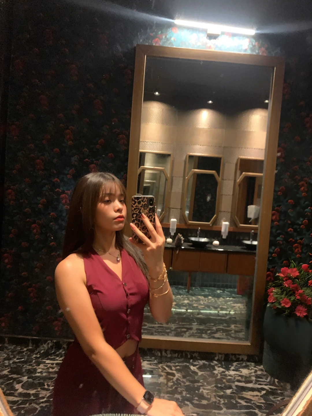there is a woman in a peach colour dress puting lipstick on her lips , standing in front of mirror, replicate the image2image, big boobs, no extra fingers, realistic face,