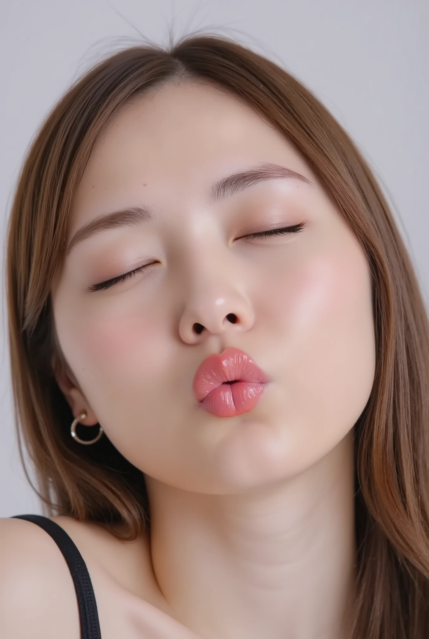 ultra-detailed close-up of a beautiful modern girl, collarbone-up composition, white studio background, soft natural lighting, soft focus on background,
camera angle slightly elevated (about 60 degrees), subject's chin gently raised, head and face facing forward, body posture suggesting slight tiptoeing,
eyes gently closed, dreamy and euphoric expression, cheeks and ears flushed with bashful blush, lips tightly puckered and strongly protruding,
mouth forming a rounded "O" shape like whistling or blowing a kiss, kissy lips, extremely glossy and moist lips with shimmering highlights,
natural-looking shiny lip gloss as the only makeup, skin is matte with visible peach fuzz and realistic pores,
subtle facial contour blur to guide viewer’s gaze toward lips, cute and soft dere-dere mood,
deeply affectionate smile while puckering, hands behind the back and not visible, black camisole straps slightly visible,
overall overflowing with affection, adorably seductive and shy charm, longing and dazed joy, subtly coquettish expression,
no vintage look, fully modern skin tone, hair texture and color corrected to current aesthetic standards