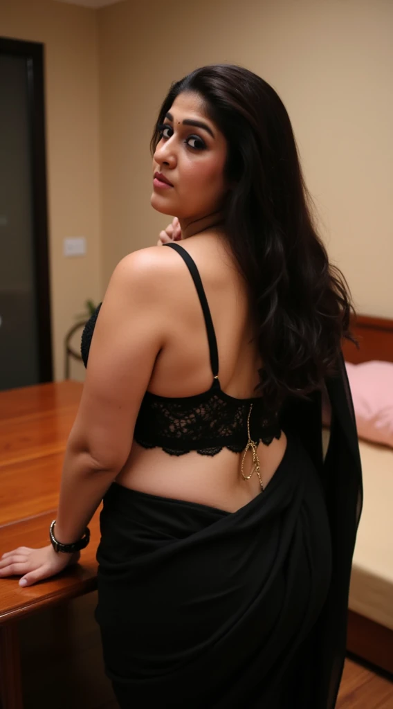 Black saree 35 yers old women and hot figar and back ground is bach