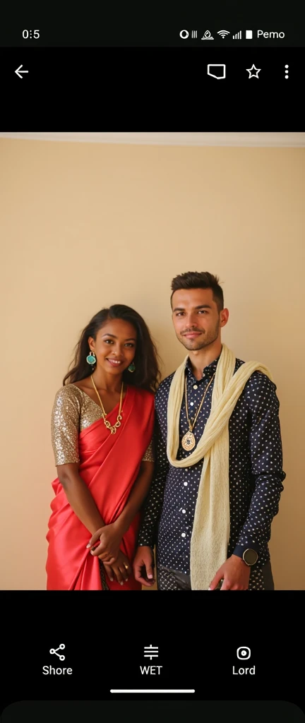 "Elsa Jean and black boy in a warm embrace, captured in a candid moment. Elsa Jean is adorned with exquisite jewelry, wearing a stunning Indian traditional saree, complemented perfectly by her striking red lipstick. Meanwhile, black boy looks dashing in a stylish kurta. The scene unfolds at a grand wedding event."