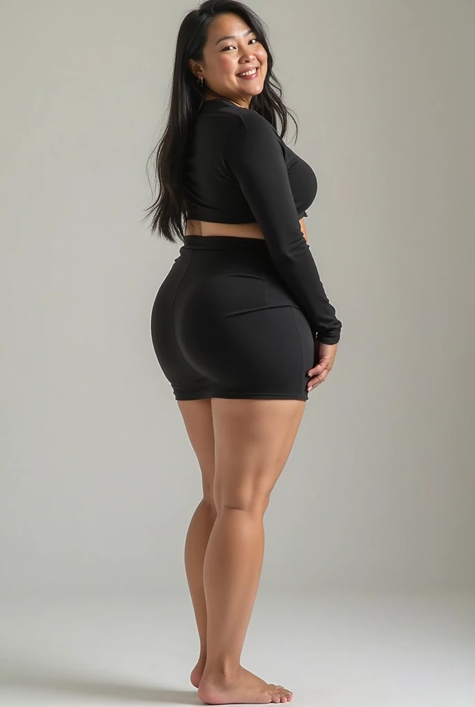 A graceful, full-bodied Indonesian woman of Arab descent, slightly chubby with tied curly hair and distinctive facial features such as thick eyebrows, brown eyes, a slit nose and a split chin, standing in a simple kitchen. This woman wears a sexu black T-shirt dress that ends above her knees, with a pose that emphasizes her elegance and confidence.