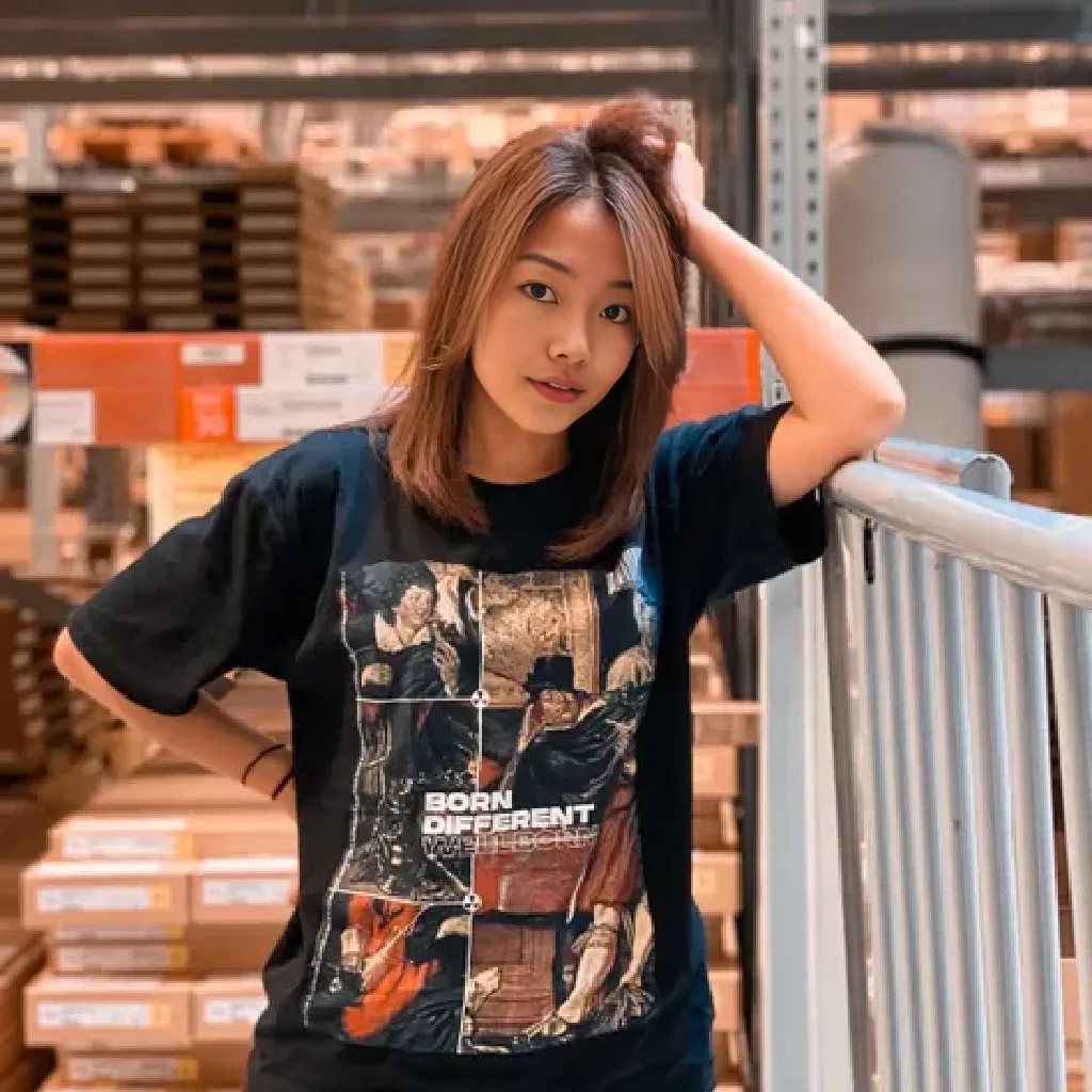 Beautiful Indonesian woman, 20 years old, long black hair, wearing a blue t-shirt, black jeans, sitting in a boutique clothing store