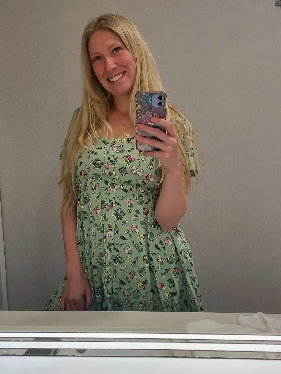 medium shot portrait of a mature,middle-aged Xevbellringer woman,wearing a mint green tunic top,kindergarten worker,exuding warmth and kindness. Stereotypical daycare interior background,daycare loaded interior,toys,games,[dimly lit with a soft pink glow:0.2],Ultra-detailed,ultra-realistic,<lora:xevbellringer:0.8>,