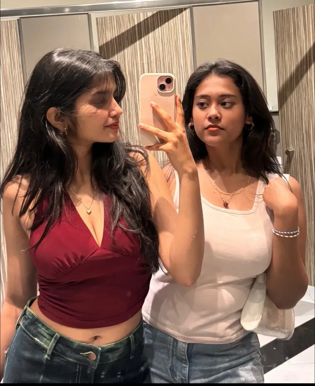 best resolution, 2 heads, two different people become conjoined, different heads, short hair, indian, eyeliner, 25 years old, cute, flirting, horny, sexy, standing in bedroom, holding phone, taking a photo, 