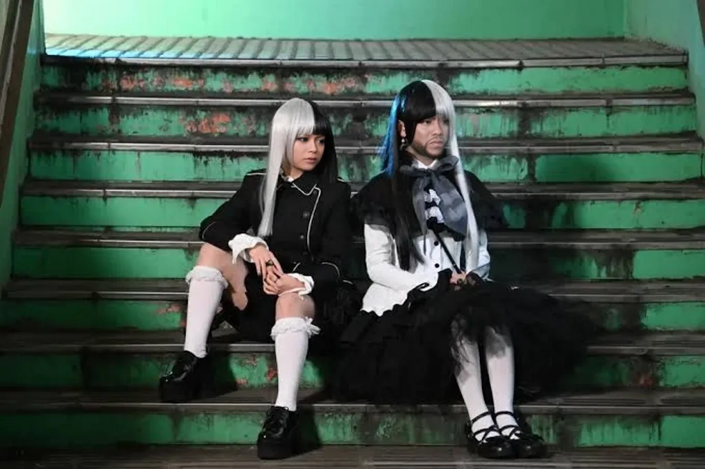 Girl with silver hair, sitting in the corner of the school classroom, doused with water by hooligans. There is fear and displacement on the face. промокла, You can already see your underwear. Torn black tights on legs. Defense textbook in hand